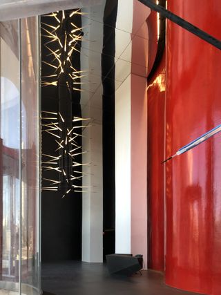 Double height lobby with chandeleir at Antares tower by Odile Decq in Barcelona