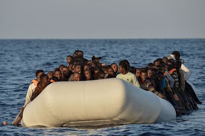 Migrants in a rubber boat near Libya.