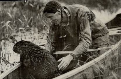 Grey Owl looking after a beaver. (Photo by Toronto Star Archives/Toronto Star via Getty Images)