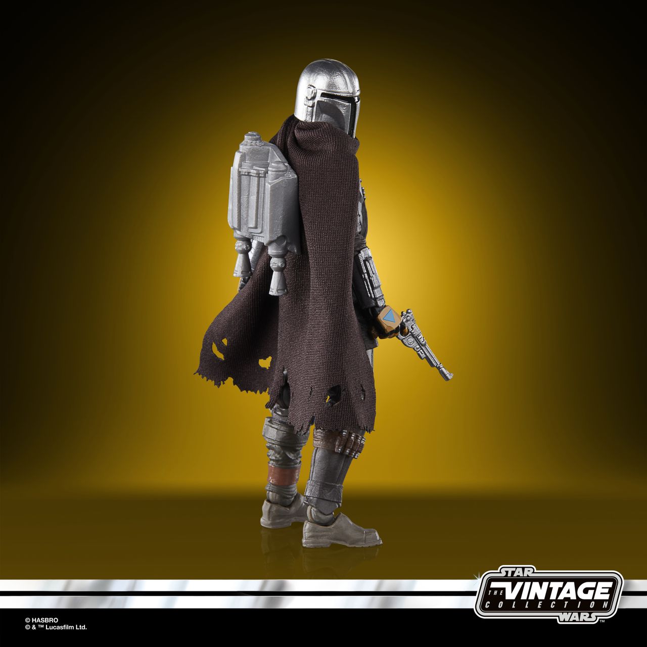 The Vintage Collection Mandalorian figure, posed on a yellow and black background