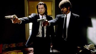John Travolta and Samuel L. Jackson pointing guns together in Pulp Fiction