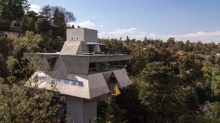 casa praxis in mexico, concrete among foliage