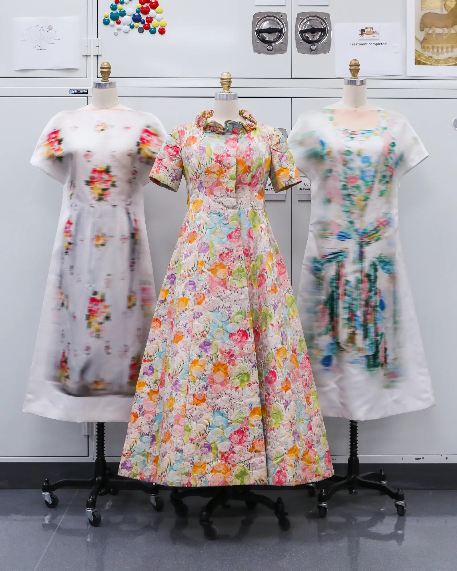 A trio of floral dresses photographed on mannequins for the 2024 Met Gala exhibition