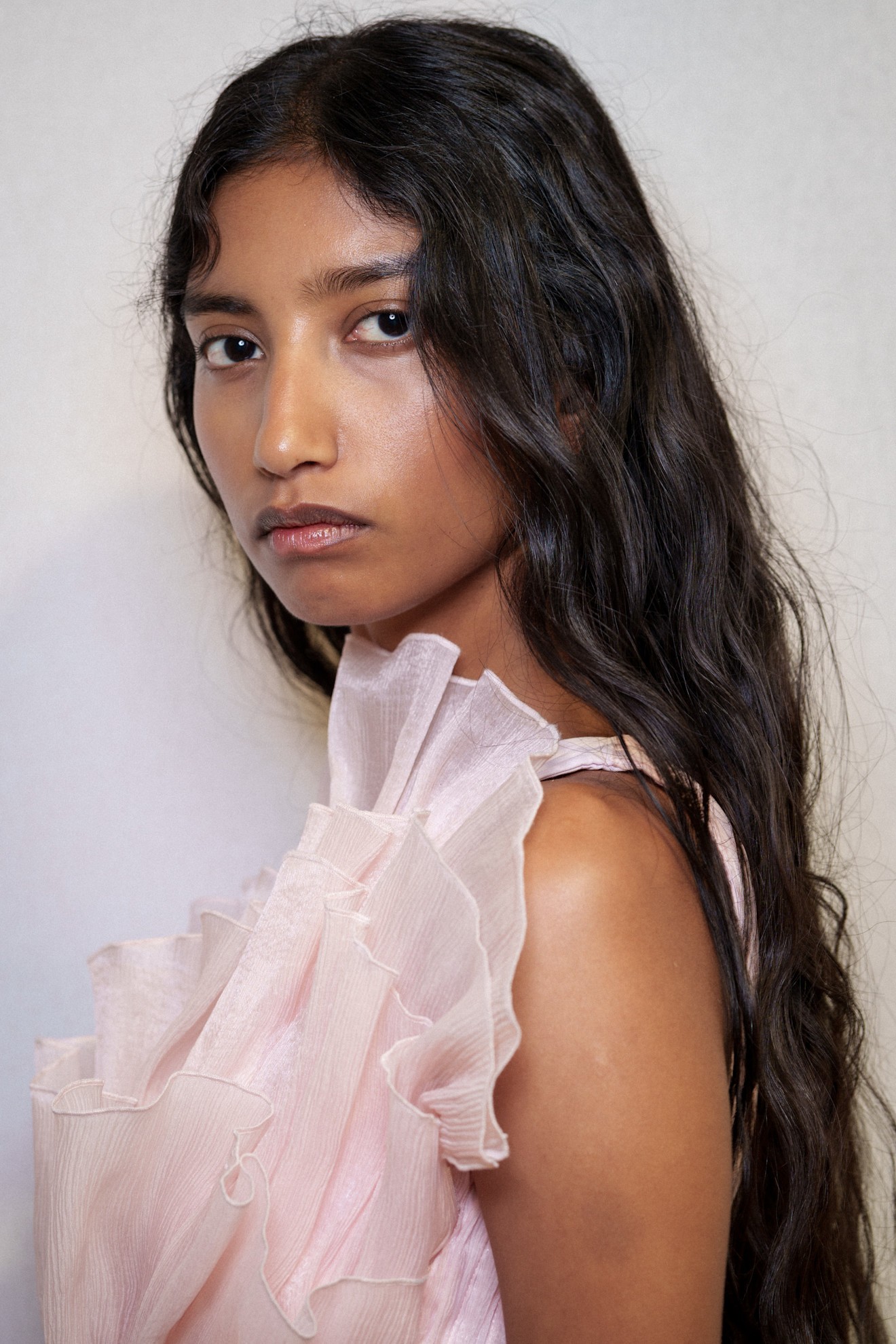 A model with their hair in a wedding hairstyle