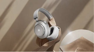 Master & Dynamic MW75 headphones on beige background