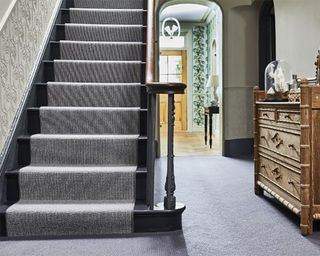 Striped staircase design by Carpetright in hallway