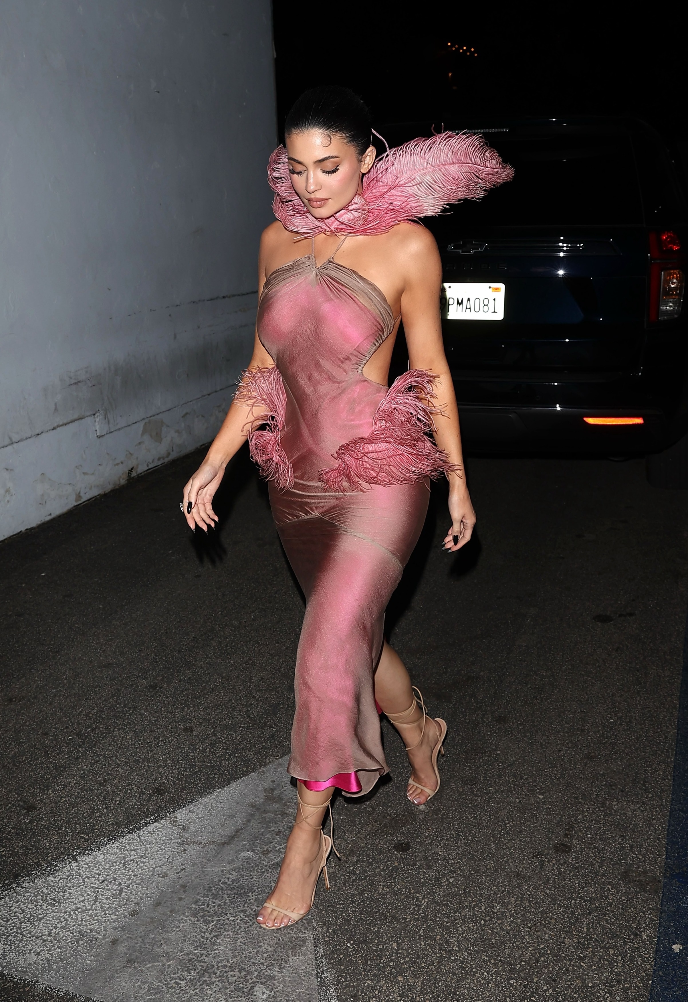 Kylie Jenner wore a fresh-off-the-runway pink Conner Ives gown to her Kylie Cosmetics holiday party