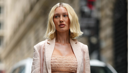 Purple toning hair masks are brilliant for brightening blonde, as this image of a model shows with her glossy blonde hair