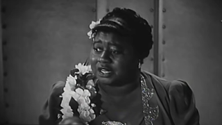 Hattie McDaniel winning her Oscar in 1940 for Gone with the Wind