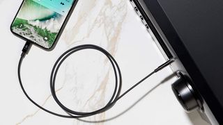 Belkin Audio Cable With Lightning Connector plugged into an iPhone.