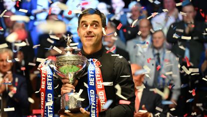 Seven-time snooker world champion Ronnie O’Sullivan poses with the trophy