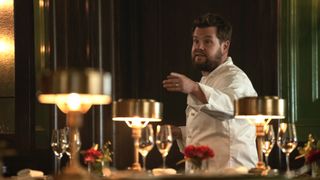 James Corden in chefs' white as Jamie gives orders in a restaurant in Mammals
