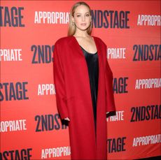 Jennifer Lawrence in a red coat by The Row