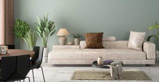 Sage green living room with beige sofa with brown cushion