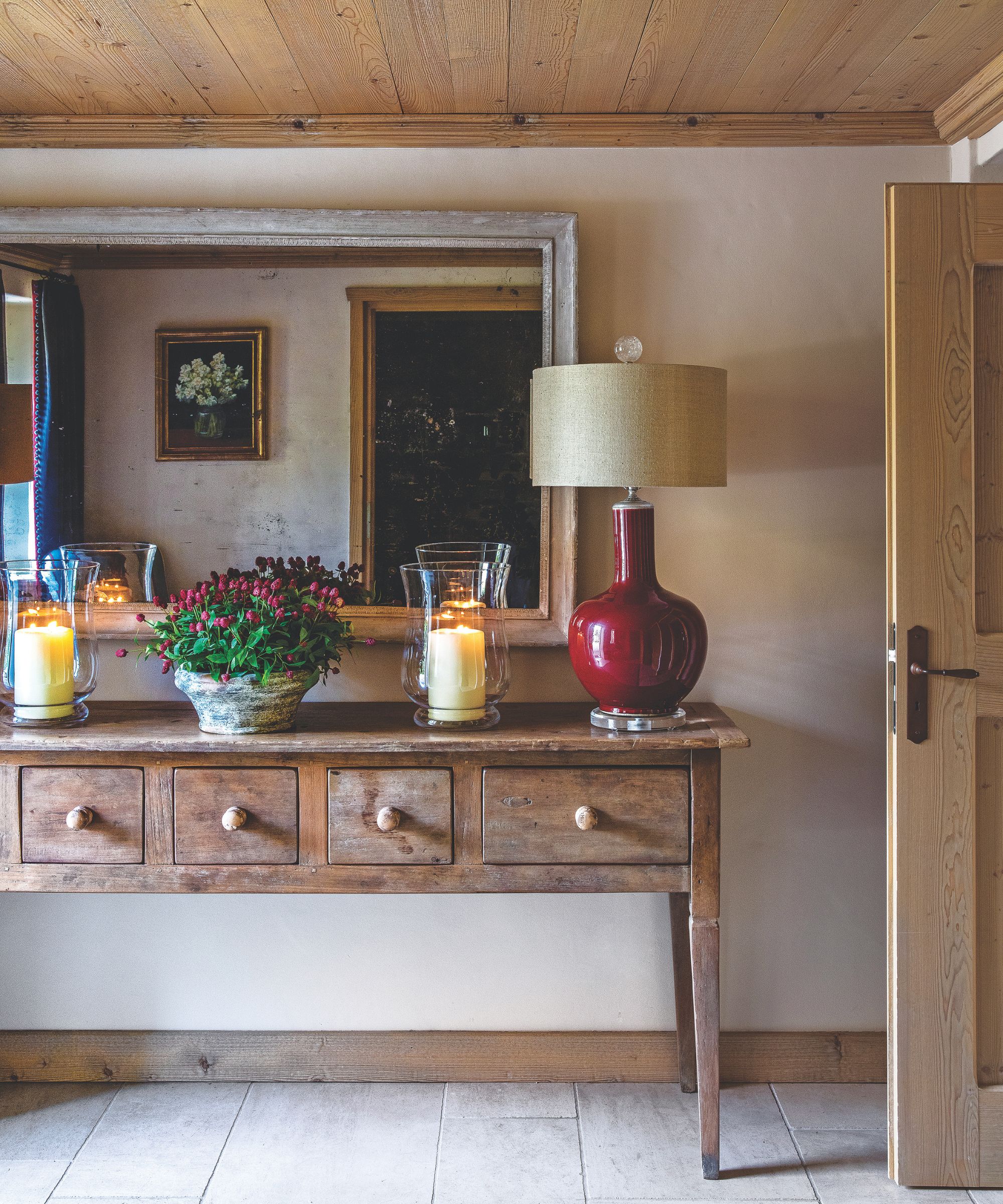 Hall sideboard with lamp and hurricane lamps