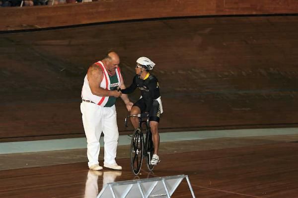 Size matters: Wood cutter David Foster and Malaysian track cyclist Azizulhasni Awang.