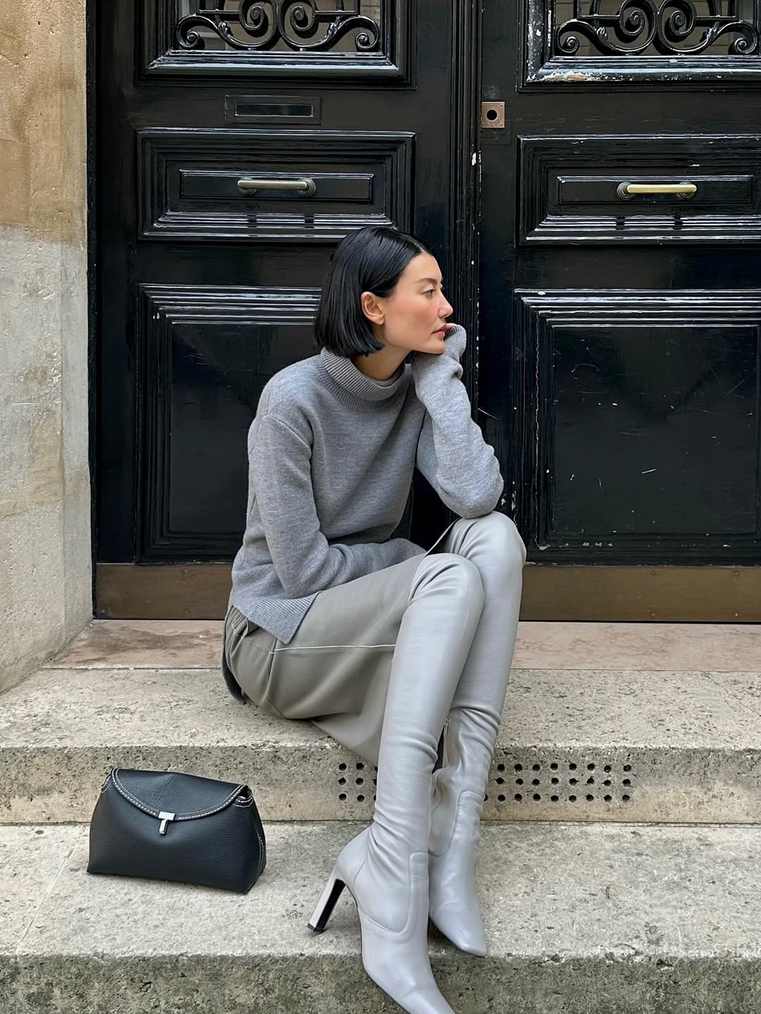amalie gassmann poses in a grey outfit
