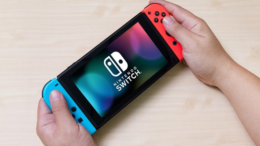 Nintendo Switch in hand 