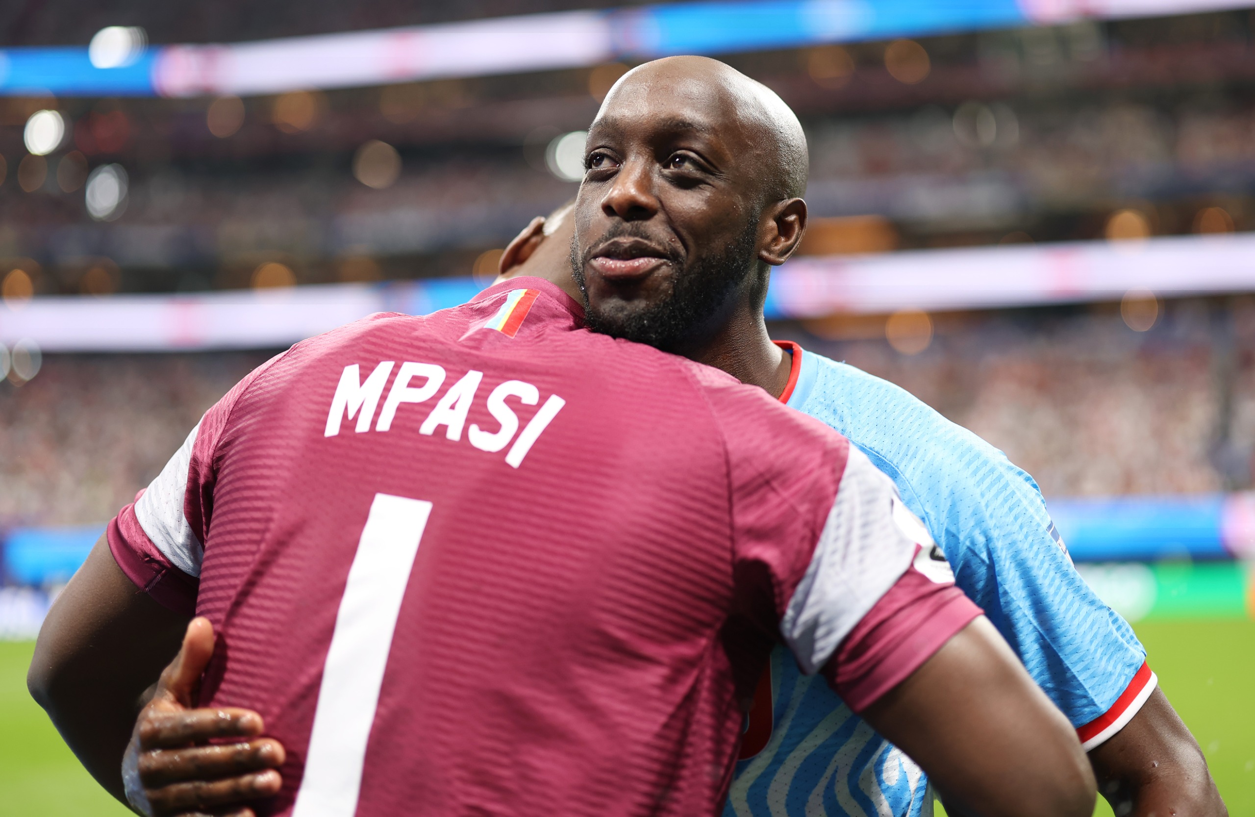Yoane Wissa and DR Congo goalkeeper Lionel Mpasi