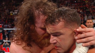 Sami Zayn hugs a dejected Chad Gable after their match on WWE Raw.