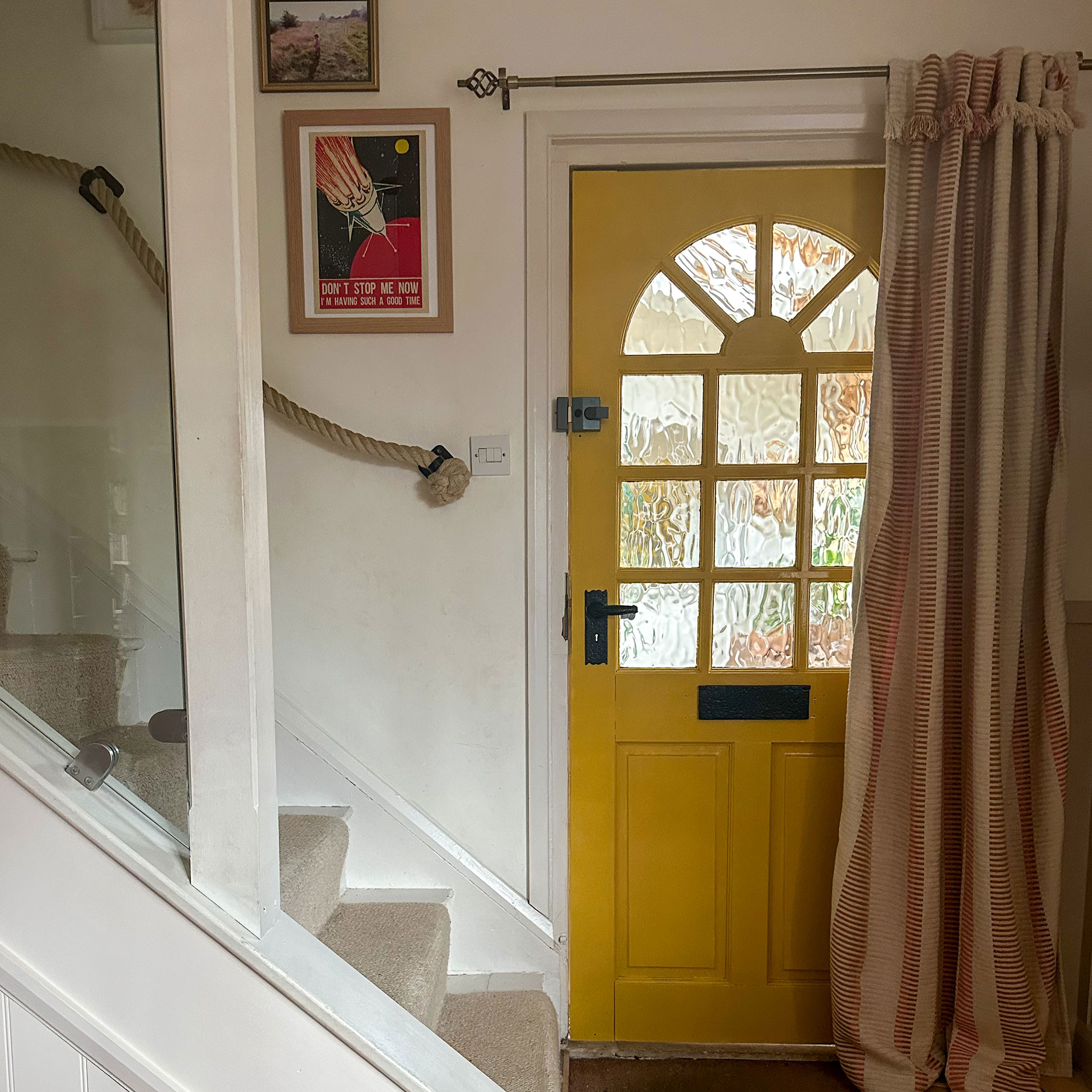 Entrance hall of home with yellow front door