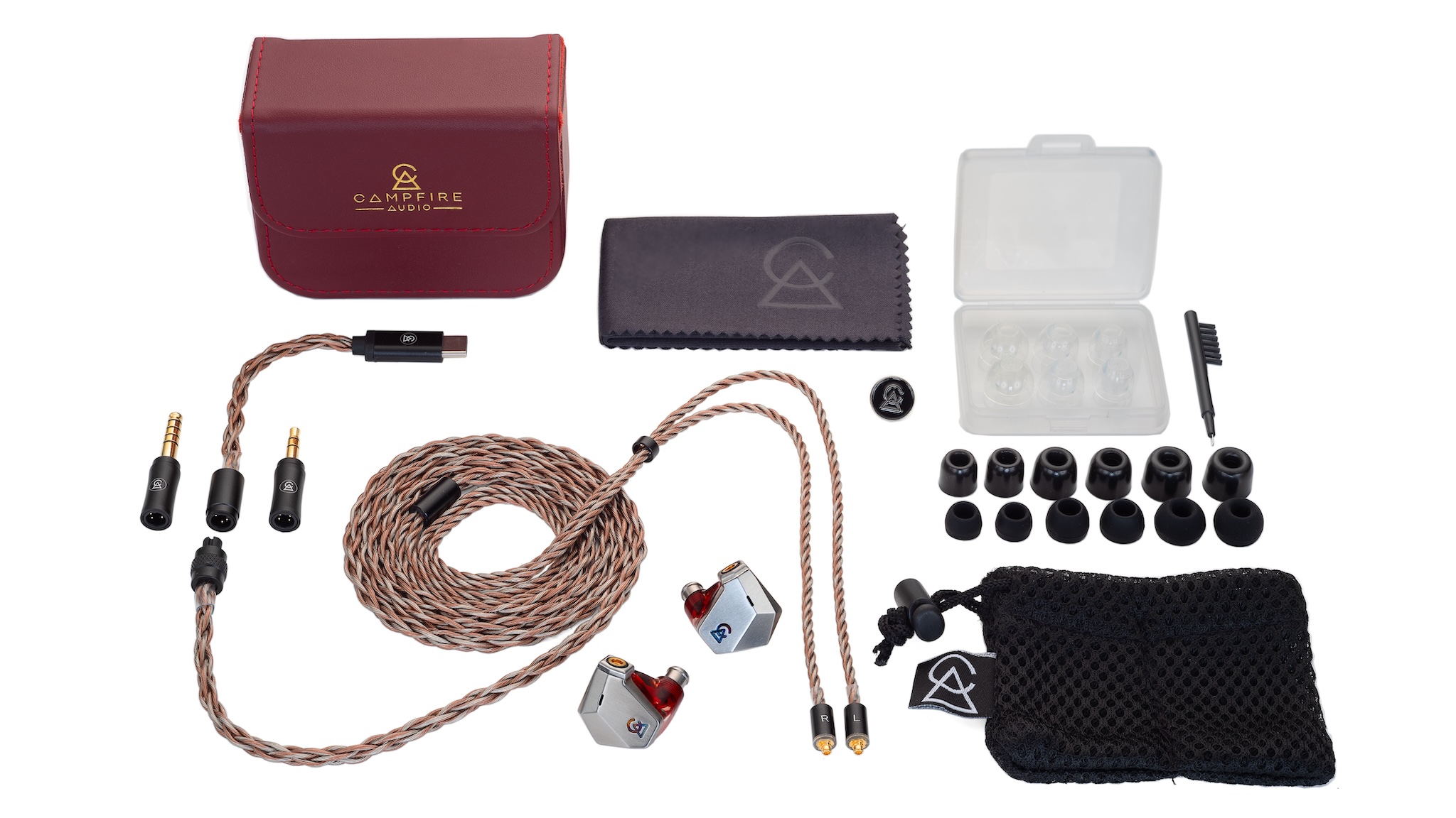 Campfire Audio Grand Luna unboxed with ear tips, cables, protective pouch and hard cases on a white surface