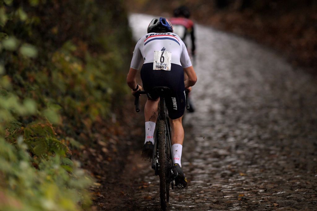 Thomas Pidcock (Trinity Racing) chases Iserbyt up the cobbled hill