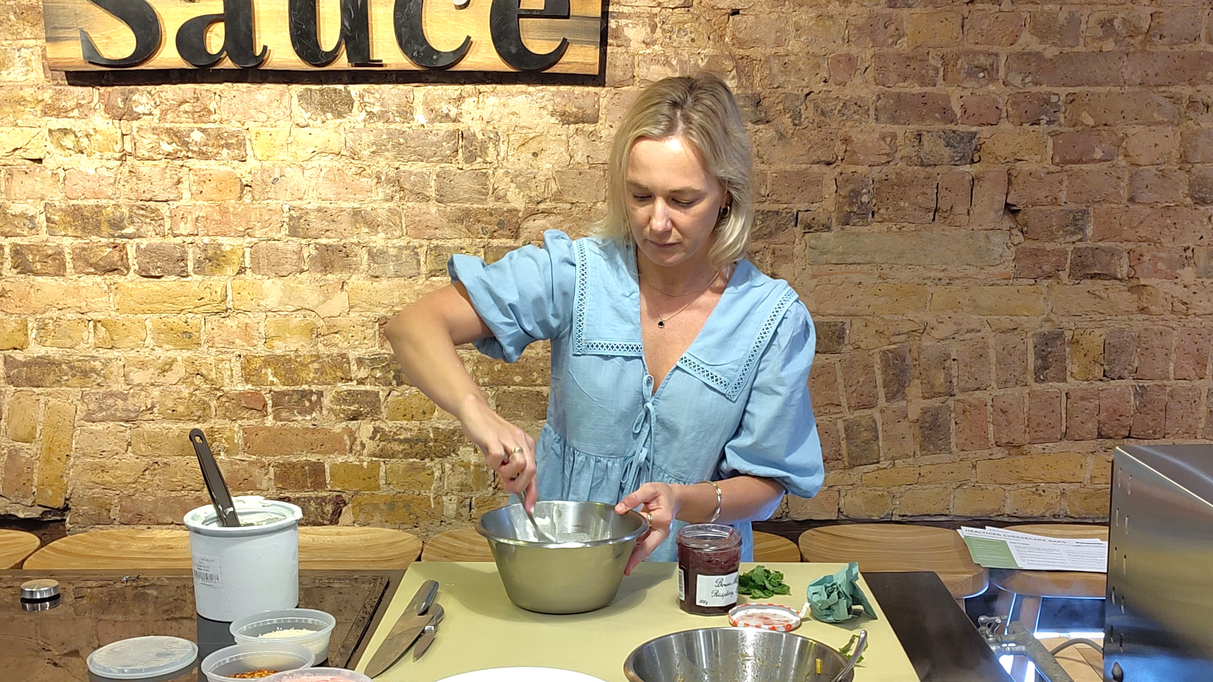 Woman preparing ice cream to freeze using Panasonic bread and ice cream maker