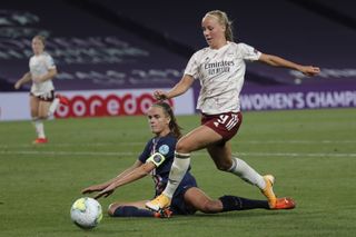 Arsenal’s Bethany Mead, right, challenges for the ball with PSG’s Irene Paredes