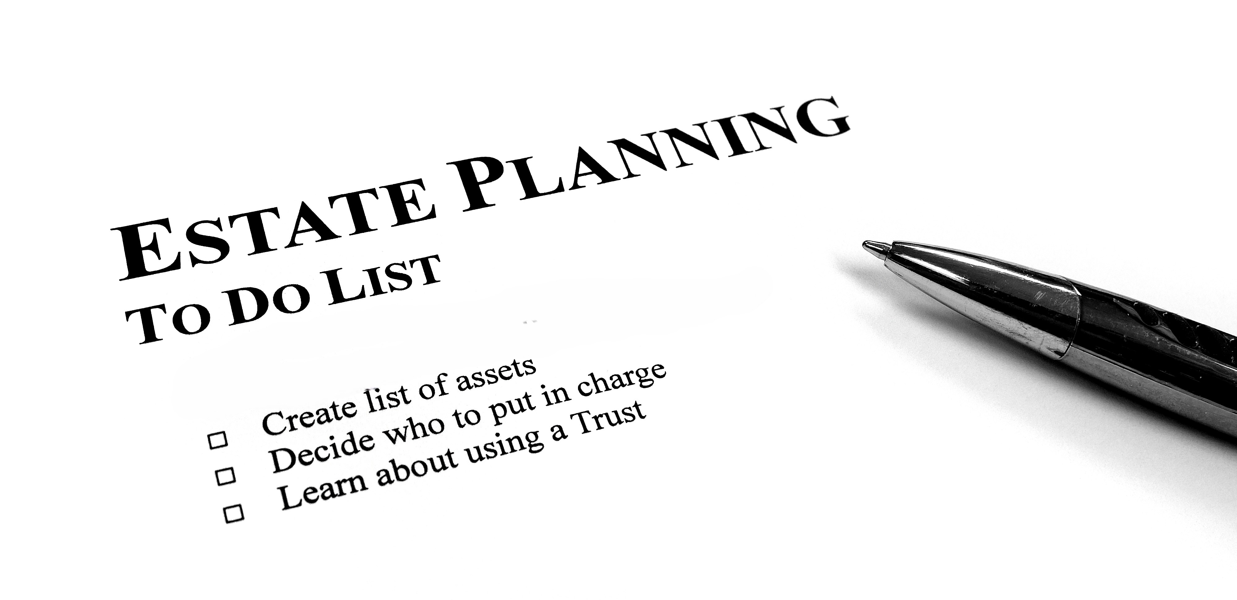 Written Estate Planning to do list on desk with pen