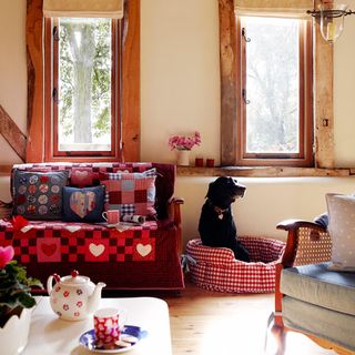room with wooden floor and dog
