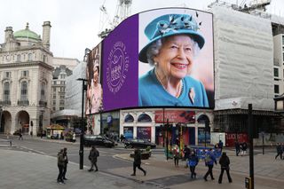Piccadilly Lights Mark 70th Anniversary Of Queen's Accession To Throne