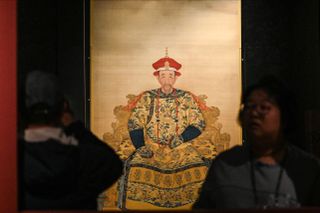 A replica of Kangxi Emperor in court robes during media preview of 'The Forbidden City and the Palace of Versailles'