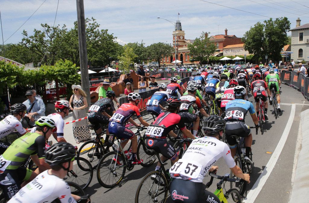 The riders roll through to complete another lap