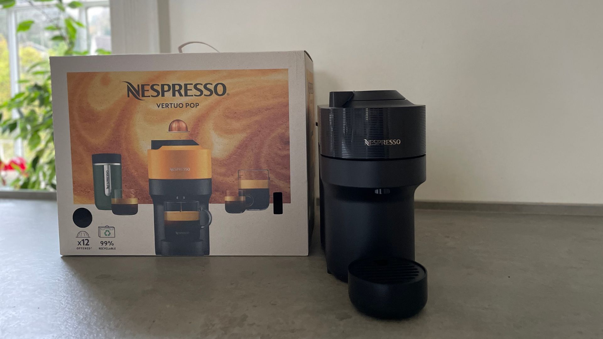 The Nespresso Vertuo Pop next to its box