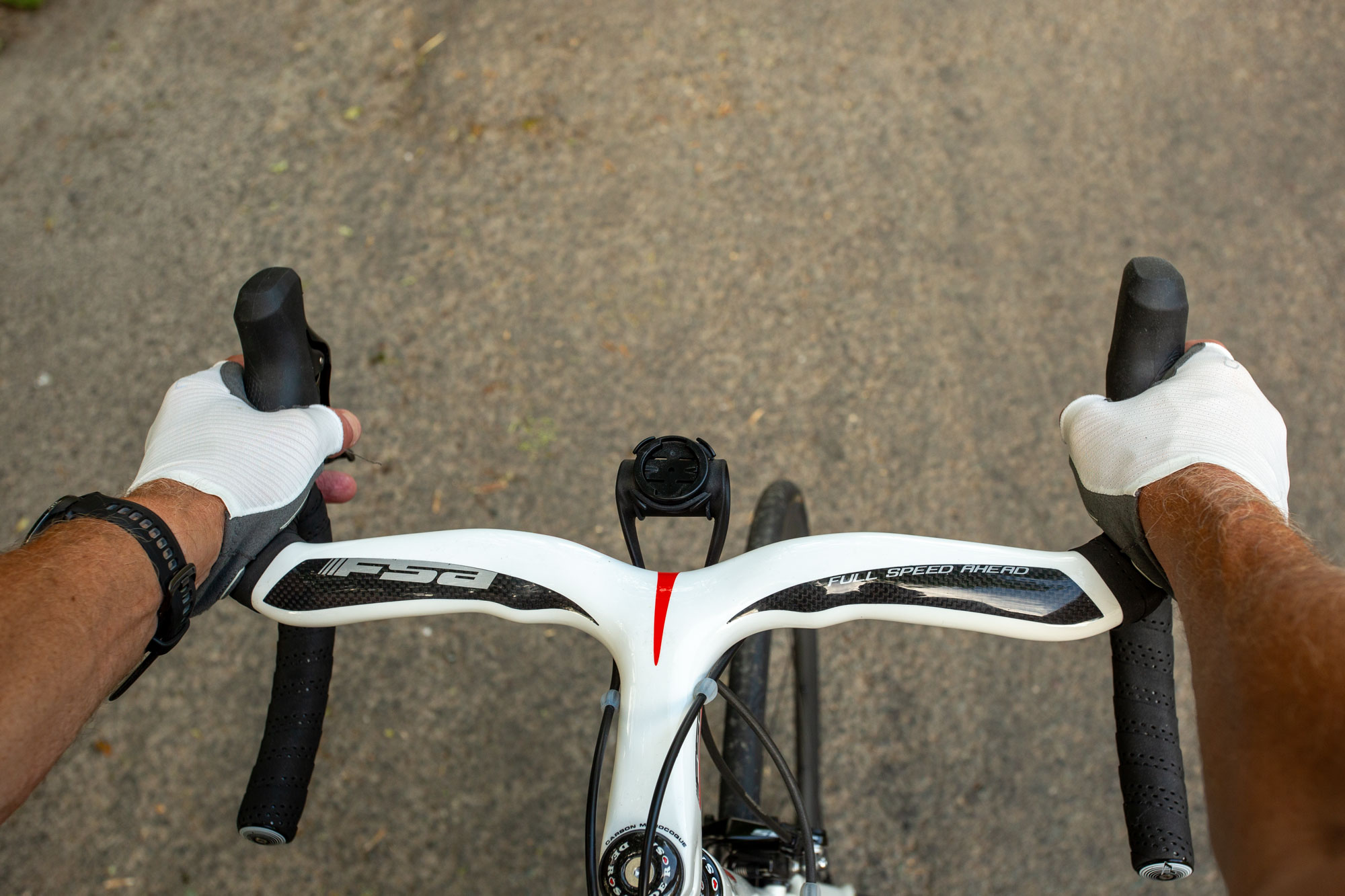 Garmin Forerunner 970 shown in riding position on drop handlebars