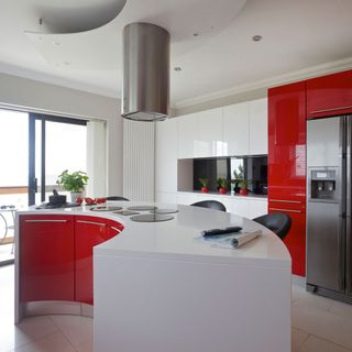 kitchen with red cabinets and worktop