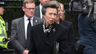 Anne, Princess Royal views the flowers left by mourners outside Balmoral Castle on September 10, 2022