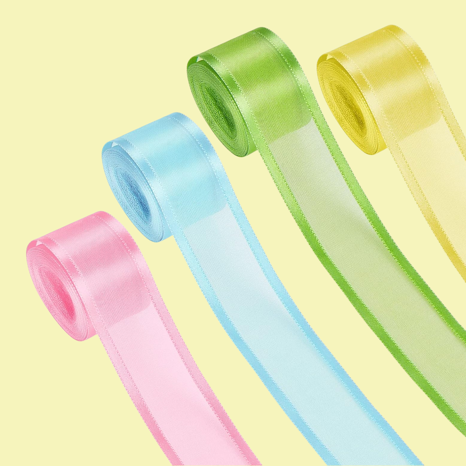 A set of four ribbon scrolls in pink, blue, green, and yellow