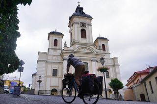Image shows Stefan cycling around Banská Štiavnica.