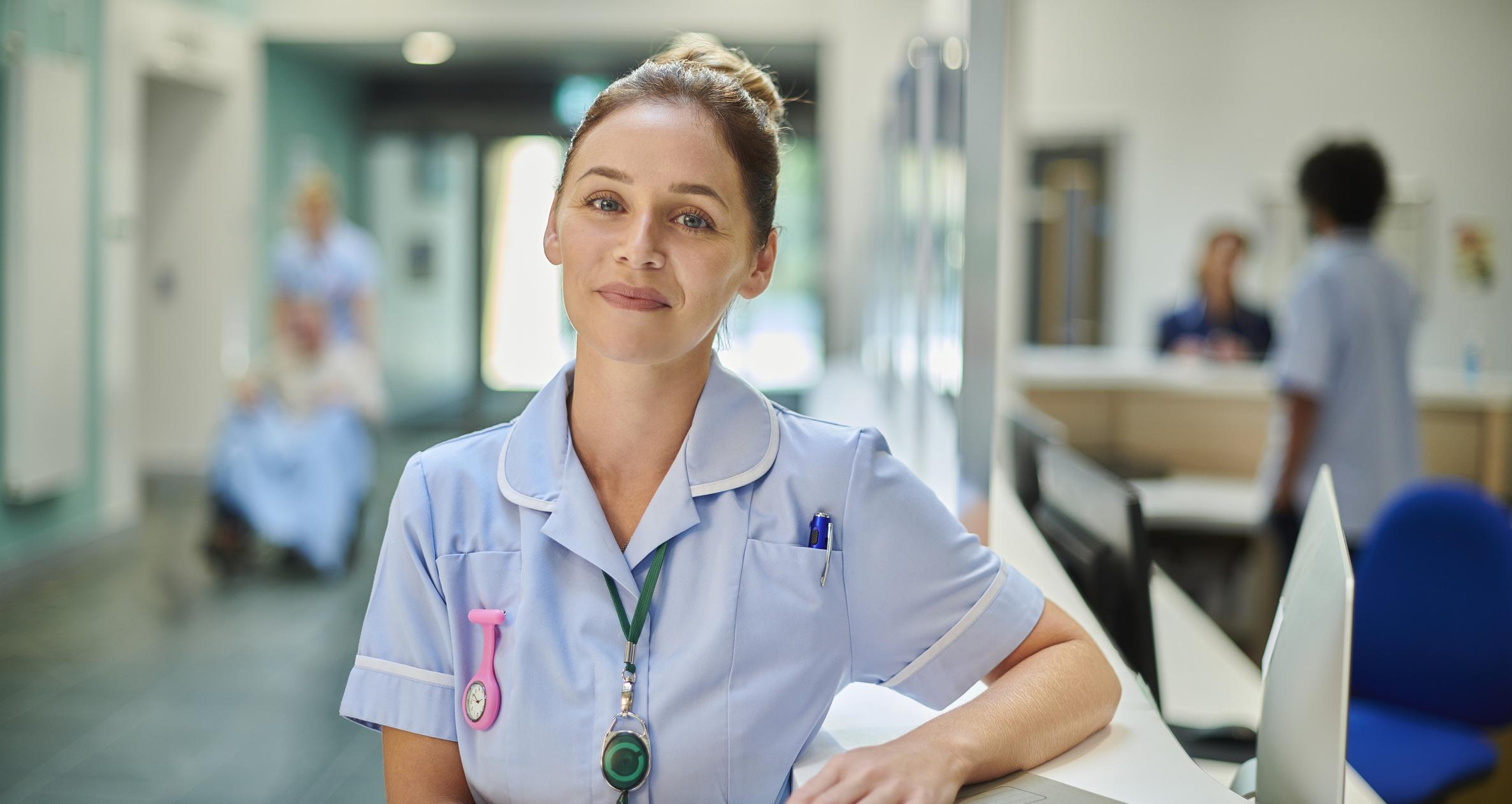  A smiling nurse working in a hospital. 