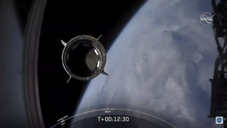 SpaceX's Demo-2 Crew Dragon spacecraft separates from its Falcon 9 upper stage to enter orbit, a historic first for a private company.