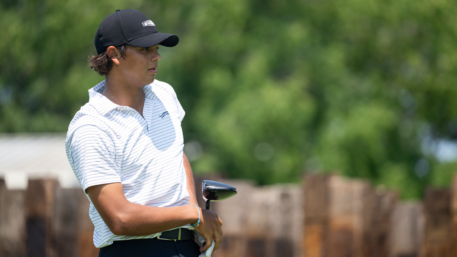 Charlie Woods watches his tee shot