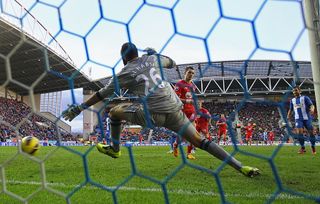 Morgan Schneiderlin of Southampton beats Ali Al Habsi of Wigan Athletic to score their second goal during the Barclays Premier League match between Wigan Athletic and Southampton at DW Stadium on February 2, 2013 in Wigan, England.