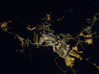 An Expedition 26 crew member on the International Space Station took this image of Brasilia, Brazil at night. City lights outline in unmistakable fashion the capital city of Brazil. Brasilia sits on a plateau, the Planalto Central, in the west-central par