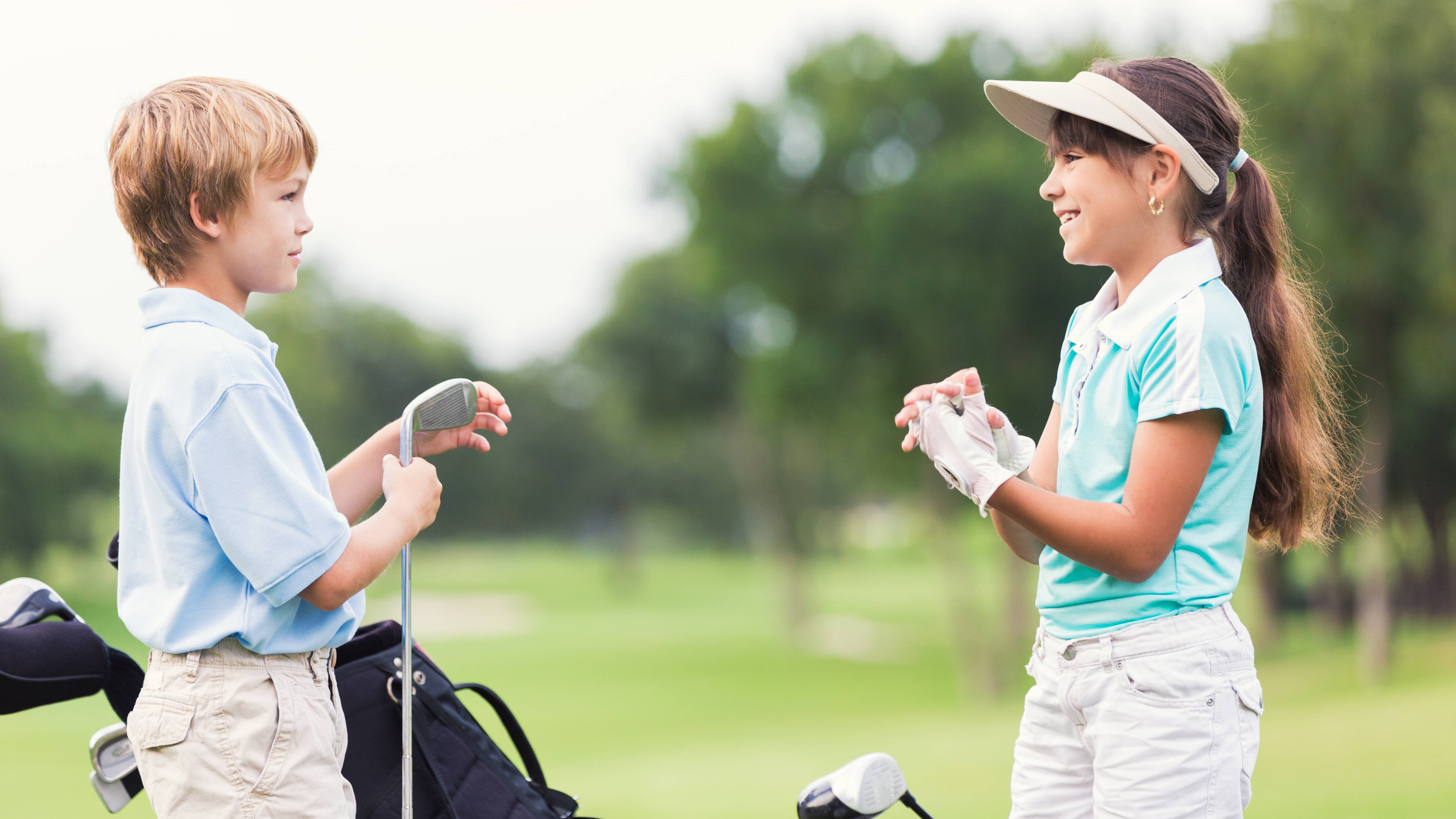 Boy and girl golfer