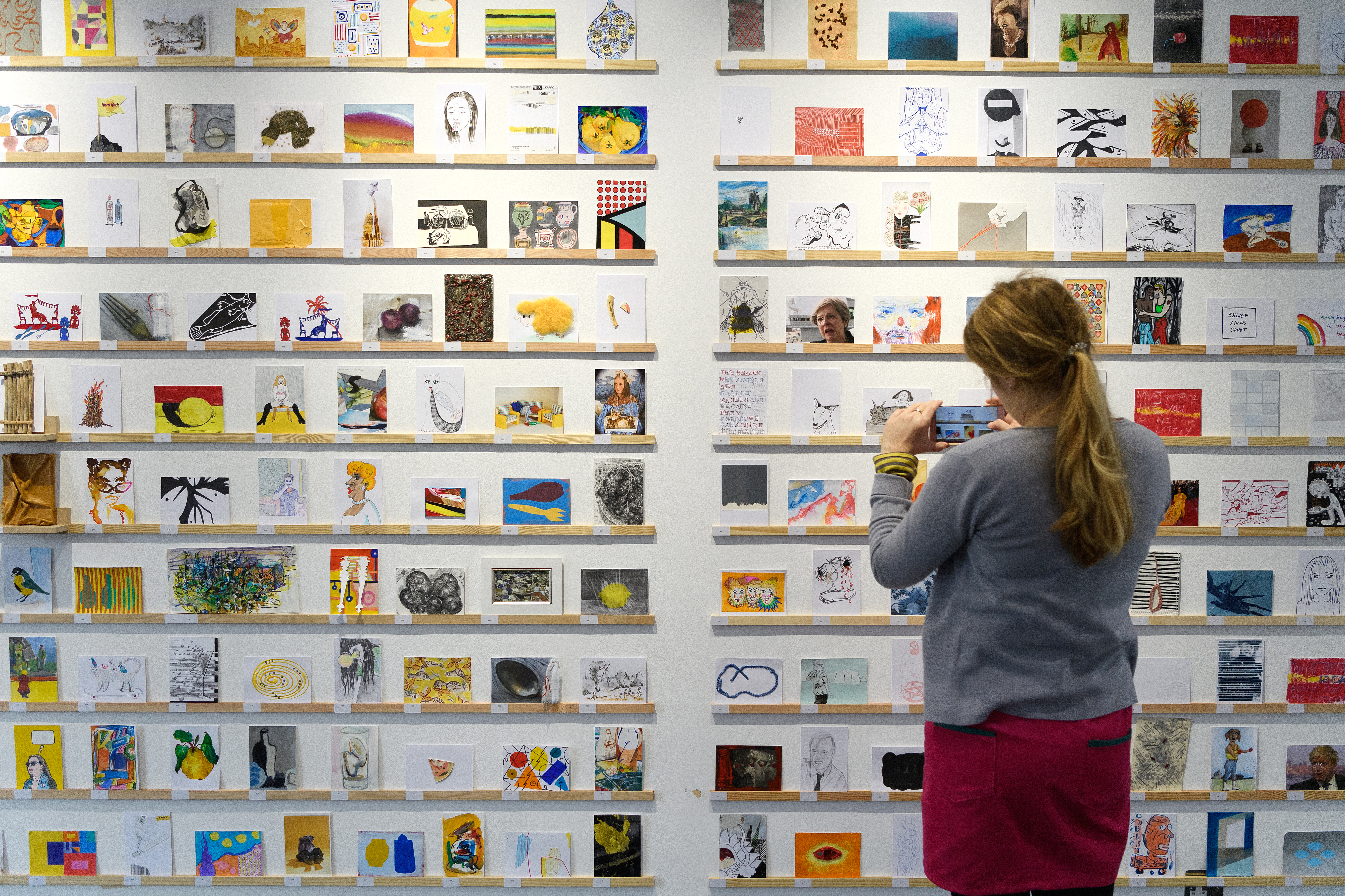 Woman looking at art