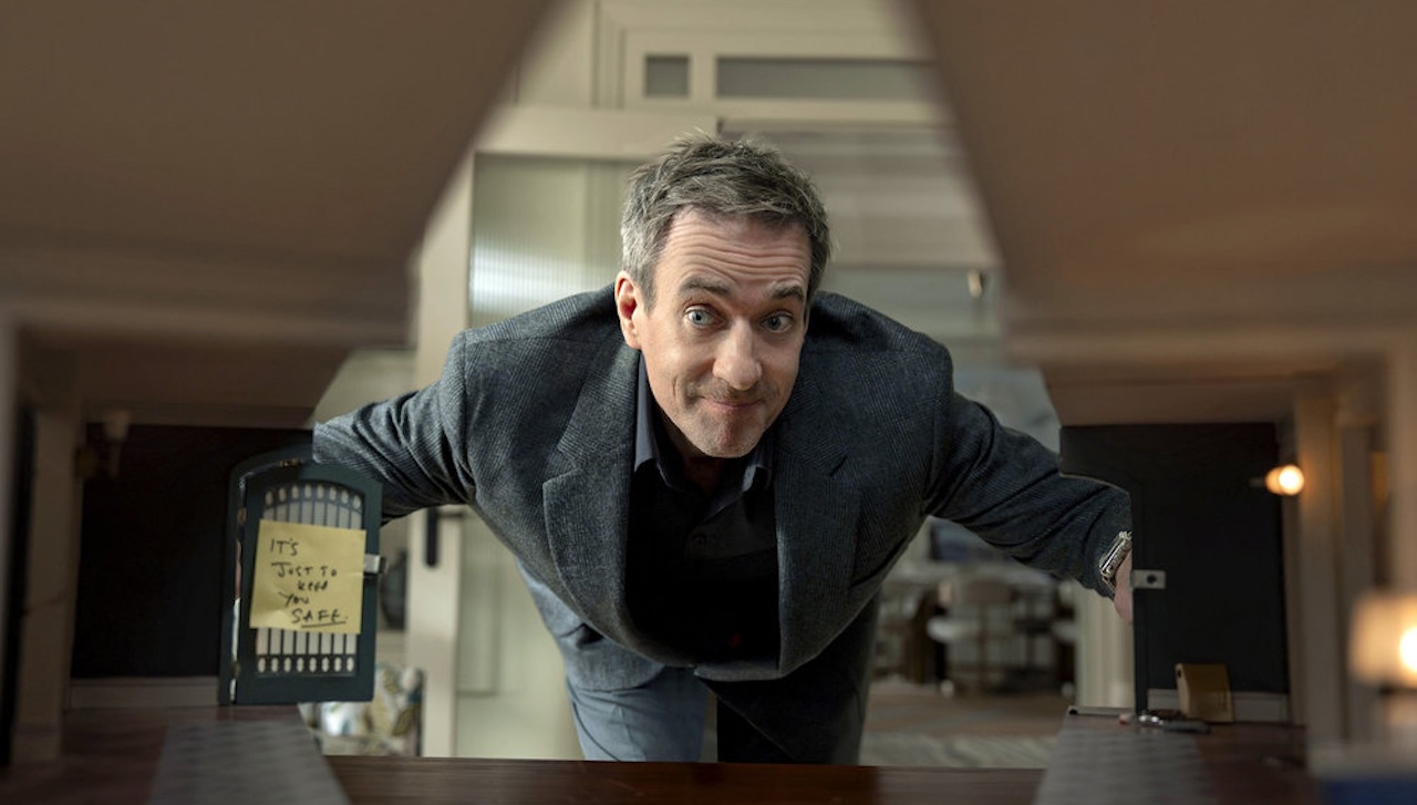 Matthew Macfadyen peering in at his wife in The Miniature Wife