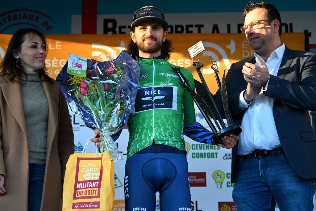 AUBAIS FRANCE FEBRUARY 02 Andrea Mifsud of France and Team Nice Metropole Cote dAzur celebrates at podium as Green Most Combative Rider Jersey winner during the 53rd Etoile de Besseges Tour Du Gard 2023 Stage 2 a 16963km stage from Bagard to Aubais EDB2021 on February 02 2023 in Aubais France Photo by Luc ClaessenGetty Images