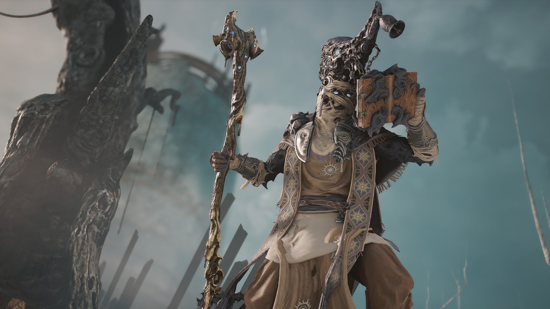 A sorcerer with bandages wrapped around his face wields a staff and a grimoire in Soulframe